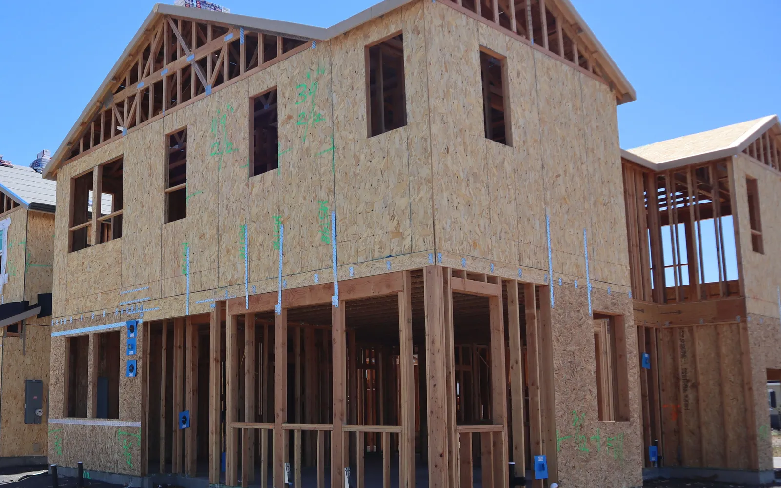 Wood-framed new houses under construction in a California subdivision