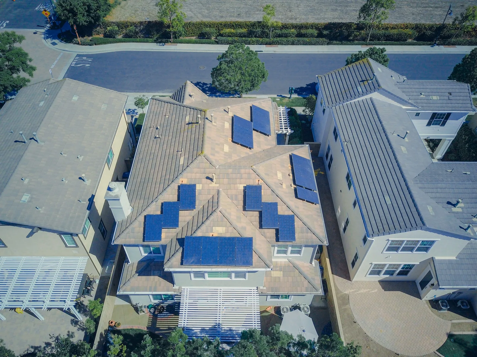 Aerial view of suburban houses with solar panels on their roofs