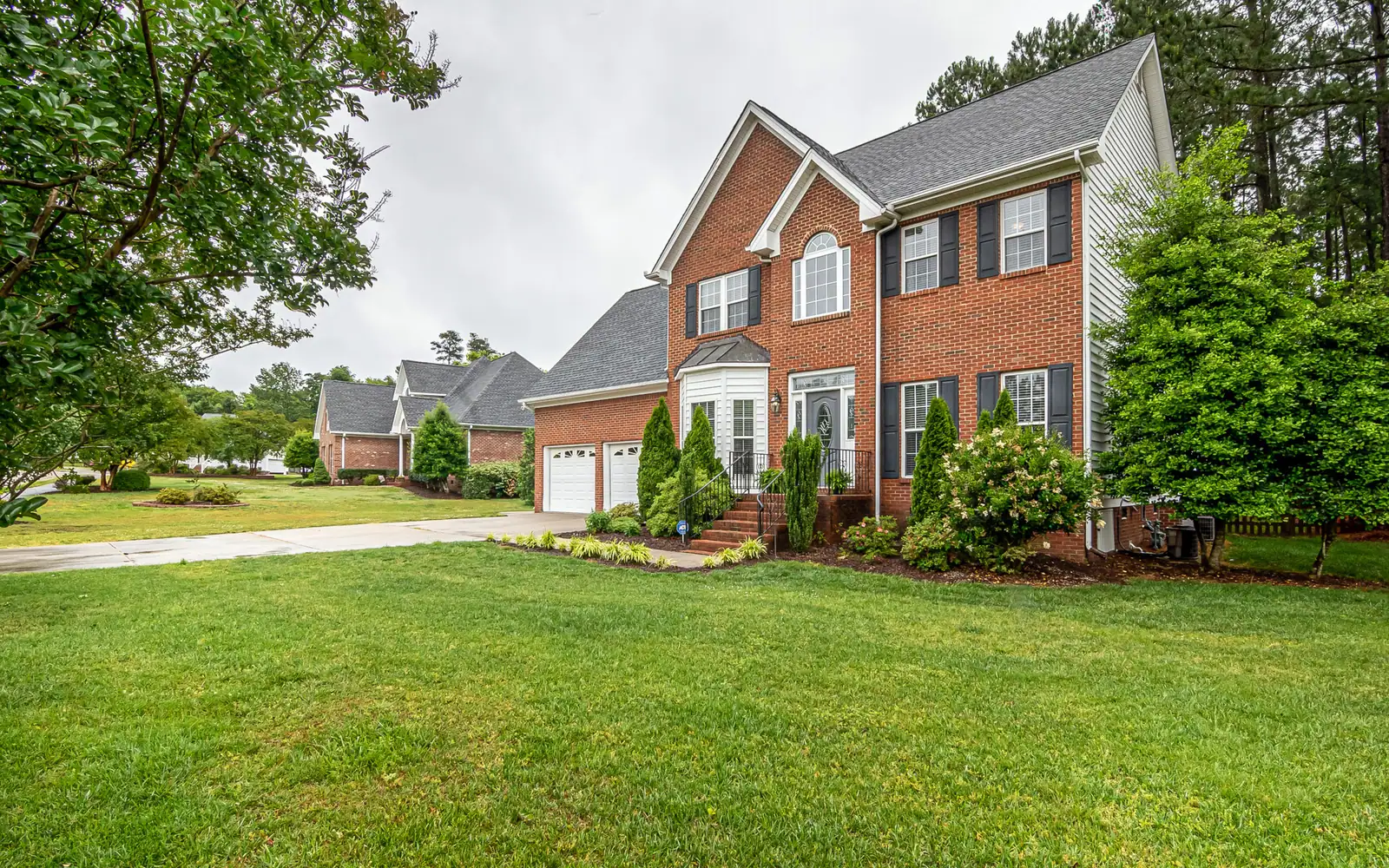 Two-story house with a garden